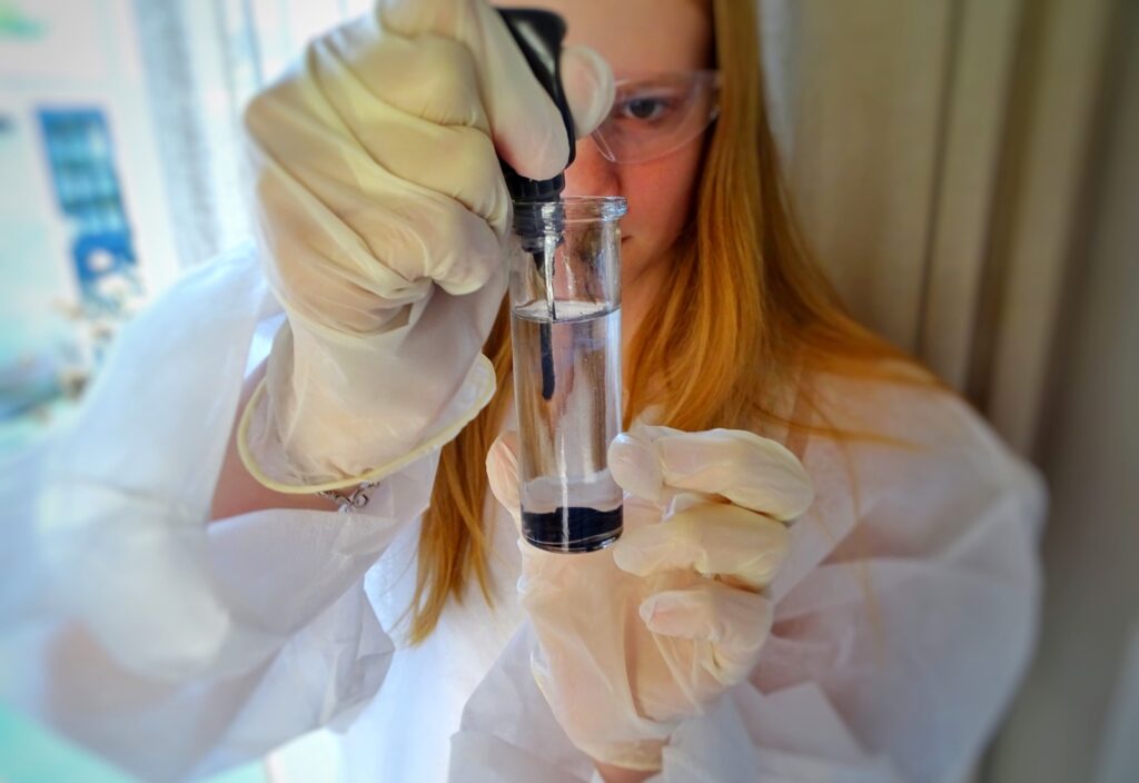 Best colleges for biology majors with student in lab